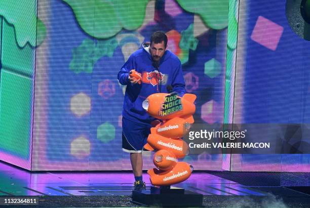 Favorite male voice from an animated movie winner for "Hotel Transylvania 3" actor Adam Sandler appears on stage during the 32nd Annual Nickelodeon...