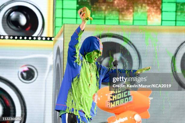Favorite male voice from an animated movie winner for 'Hotel Transylvania 3' actor Adam Sandler gets slimed on stage during the 32nd Annual...
