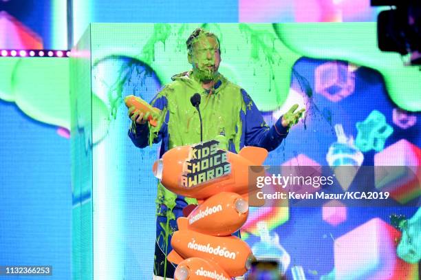 Favorite male voice from an animated movie winner for 'Hotel Transylvania 3' actor Adam Sandler gets slimed on stage during the 32nd Annual...