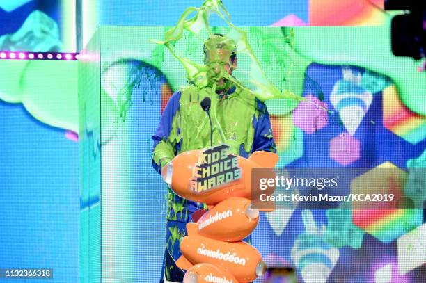 Favorite male voice from an animated movie winner for 'Hotel Transylvania 3' actor Adam Sandler gets slimed on stage during the 32nd Annual...