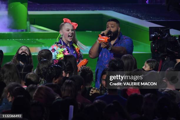 Dancer Jojo Siwa and DJ Khaled get awards on stage during the 32nd Annual Nickelodeon Kids' Choice Awards at the USC Galen Center on March 23, 2019...