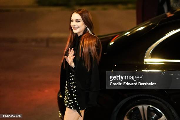 Lindsay Lohan attends the Saint Laurent show, during Paris Fashion Week Womenswear Fall/Winter 2019/2020, on February 26, 2019 in Paris, France.