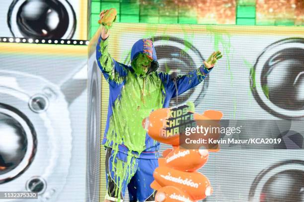 Favorite male voice from an animated movie winner for 'Hotel Transylvania 3' actor Adam Sandler gets slimed on stage during the 32nd Annual...