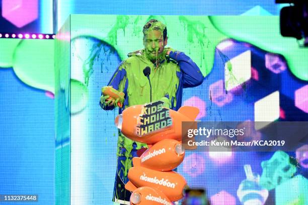 Favorite male voice from an animated movie winner for 'Hotel Transylvania 3' actor Adam Sandler gets slimed on stage during the 32nd Annual...