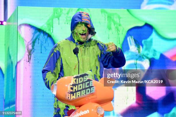 Favorite male voice from an animated movie winner for 'Hotel Transylvania 3' actor Adam Sandler gets slimed on stage during the 32nd Annual...