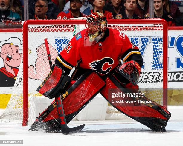 Mike Smith of the Calgary Flames watches the play during an NHL game against the Anaheim Ducks on February 22, 2019 at the Scotiabank Saddledome in...