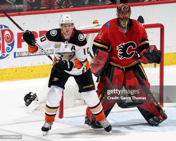 Corey Perry of the Anaheim Ducks looks for a pass while in front of Mike Smith of the Calgary Flames during an NHL game on February 22, 2019 at the...