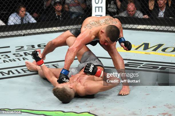 Anthony Pettis punches Stephen Thompson in their welterweight bout during the UFC Fight Night event at Bridgestone Arena on March 23, 2019 in...