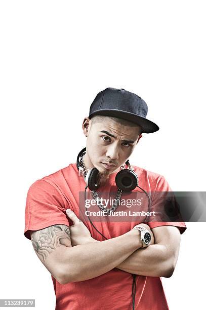 oriental youth with arms crossed - hiphop stock-fotos und bilder