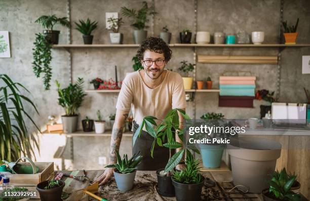 cheerful florist man - florest stock pictures, royalty-free photos & images