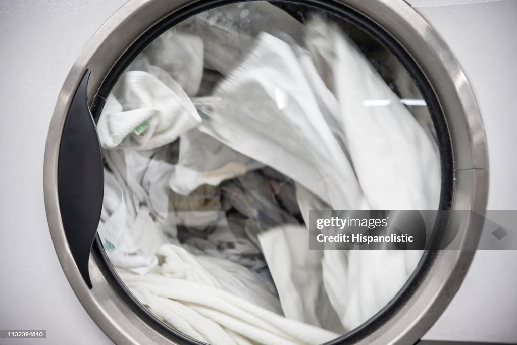 Close up of industrial washing machine at a laundromat