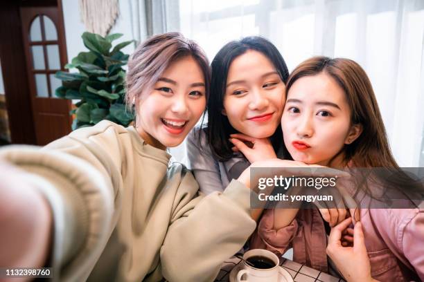 chinese girls taking a selfie - chinese girl stock pictures, royalty-free photos & images