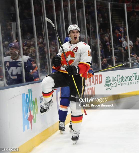 Mikael Backlund of the Calgary Flames scores the game winning goal at 3:15 of the third period against the New York Islanders at NYCB Live's Nassau...