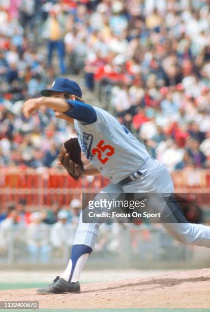 Tommy John of the Los Angeles Dodgers pitches against the Philadelphia Phillies during a Major League Baseball game circa 1974 against the...