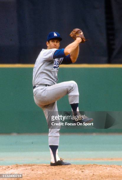 Tommy John of the Los Angeles Dodgers pitches against the Philadelphia Phillies during a Major League Baseball game circa 1975 against the...