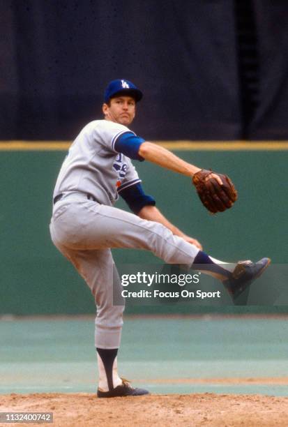 Tommy John of the Los Angeles Dodgers pitches against the Philadelphia Phillies during a Major League Baseball game circa 1975 against the...