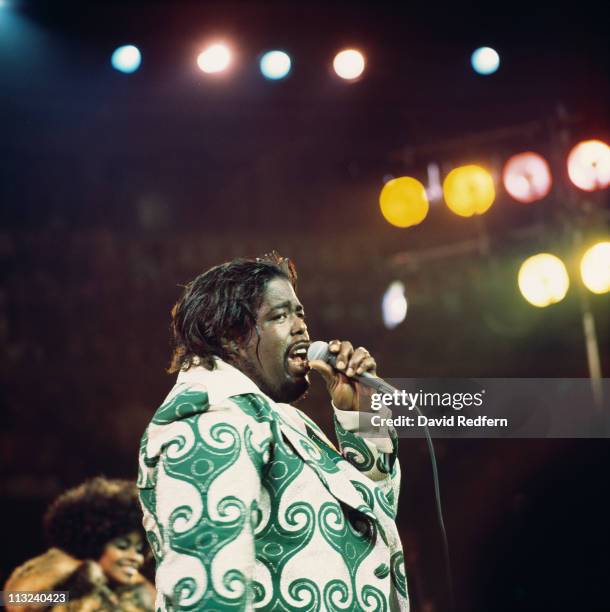 Barry White , U.S. Soul singer, singing into a microphone during a live concert performance at the Royal Albert Hall, London, England, Great Britain,...