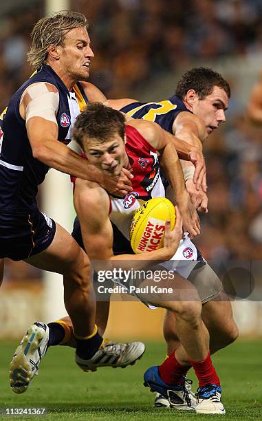 Mark Nicoski of the Eagles tackles Jordan Gysberts of the Demons during the round six AFL match between the West Coast Eagles and the Melbourne...