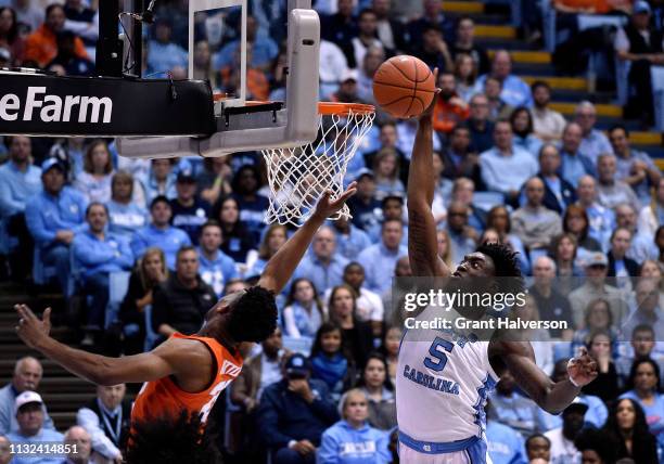 Nassir Little of the North Carolina Tar Heels blocks a shot by Tyus Battle of the Syracuse Orange during the second half of their game at the Dean...
