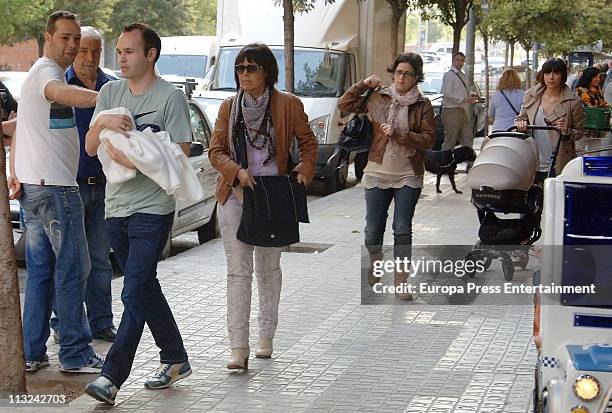 Barcelona football player Andres Iniesta and his wife Ana Ortiz are sighted with their daughter Valeria on April 28, 2011 in Barcelona, Spain.