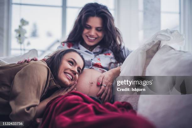 baby girl is moving in mamas stomach. - parents baby sister stock pictures, royalty-free photos & images