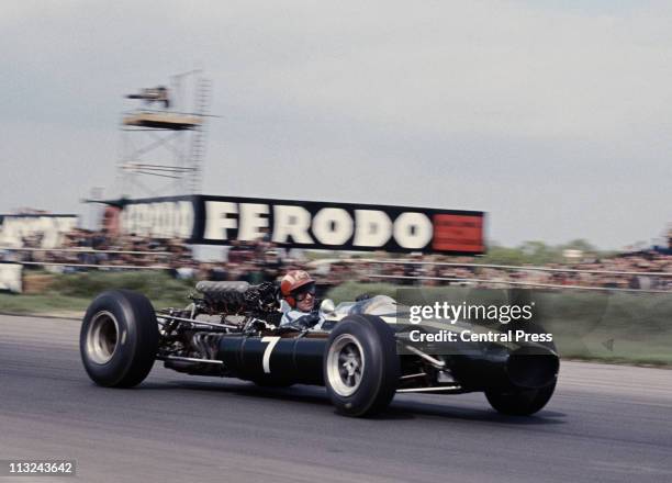 Josef Siffert drives the Rob Walker Racing Cooper-Maserati T81 Maserati 3.0 V12 during the XVIII BRDC International Trophy Race on 14th May 1966 at...