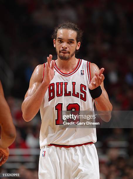 Joakim Noah of the Chicago Bulls applauds in Game Five of the Eastern Conference Quarterfinals against the Indiana Pacers during the 2011 NBA...