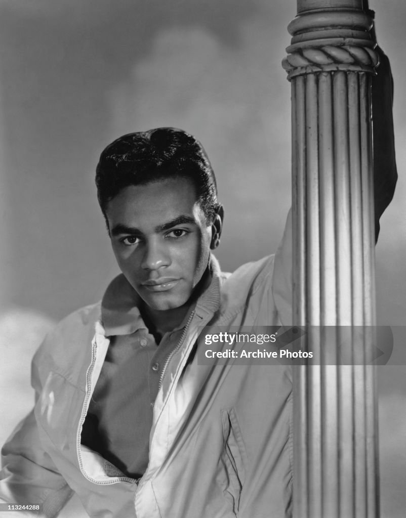 Tony Mathis Singer Portrait of American singer Johnny Mathis holding on to a lamp post ...