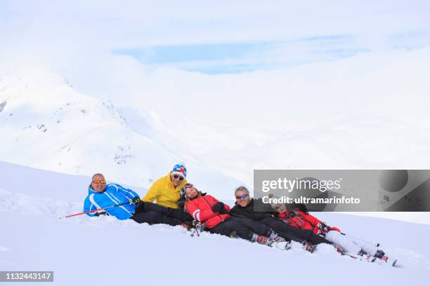 amateur winter sports  alpine skiing. group of skiers. best friends men and women, snow skiers, enjoying  skiing.  high mountain snowy landscape. livigno mountain range, alps. it is located in the italiy. - amateur photography stock pictures, royalty-free photos & images