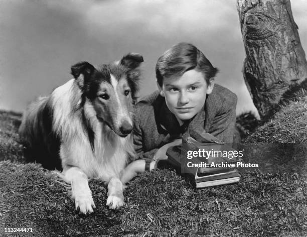Actor Roddy McDowall with Lassie in the 1943 film 'Lassie Come Home'.