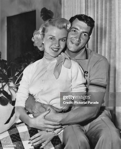 Actor and singer Dean Martin at home with his wife Jeanne Biegger between shoots for his film 'Jumping Jacks' in 1952.