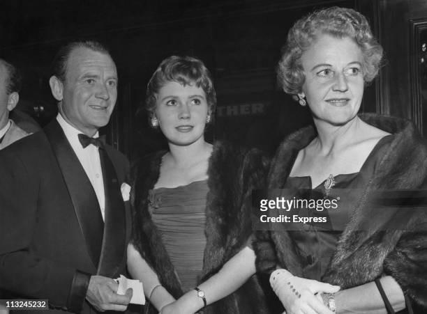 British actor John Mills with his daughter actress Juliette Mills and Mary Hayley Bell at the premiere of the film 'Raintree Country' in London,...
