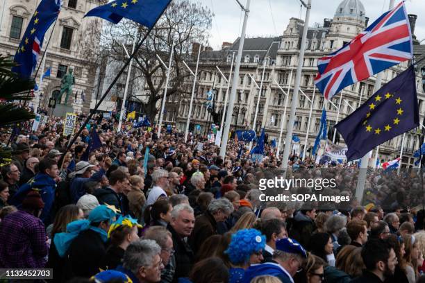 Demonstrators seen gathered to listen to speeches during the protest. Over one million protesters gathered at the People's Rally in London demanding...