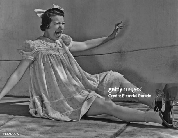 American actress Fanny Brice as 'Baby Snooks' wearing roller skates in July 1938.