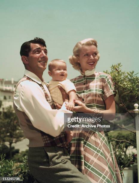 Actor and singer Dean Martin with wife Jeanne Biegger and one of their children in the 1950's.