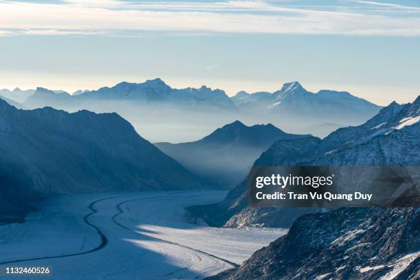 view of the alps mountains from the view of jungfraujoch station, switzerland. - jungfraujoch stock pictures, royalty-free photos & images