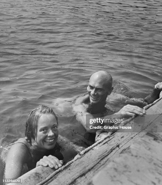 Actor Yul Brynner in the water with his wife actress Virginia Gilmore in Norwalk, Connecticut in 1957.