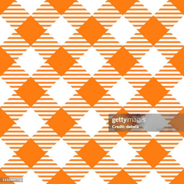 orange tablecloth argyle pattern background - argyle background stock illustrations