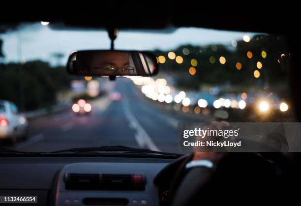 blurred drive in night - car interior stock pictures, royalty-free photos & images