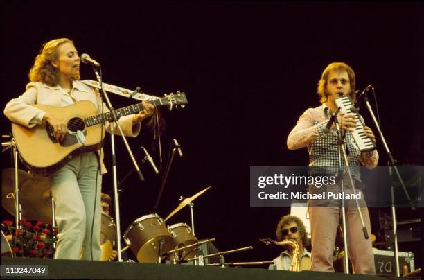 Joni Mitchell and Tom Scott perform on stage, supporting Crosby, Stills, Nash and Young at Wembley Stadium, London, 14th September 1974.