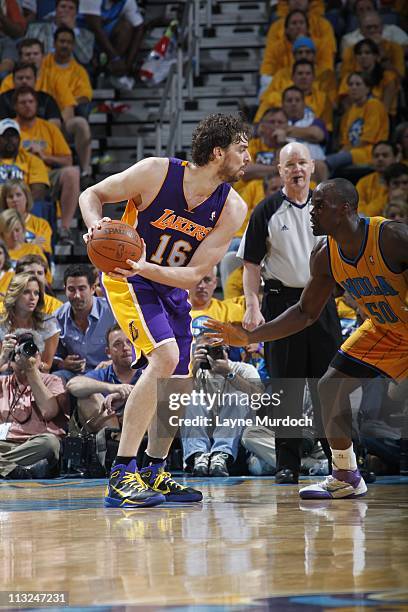 Pau Gasol of the Los Angeles Lakers moves the ball against the New Orleans Hornets on April 22, 2011 during Game Three of the Western Conference...