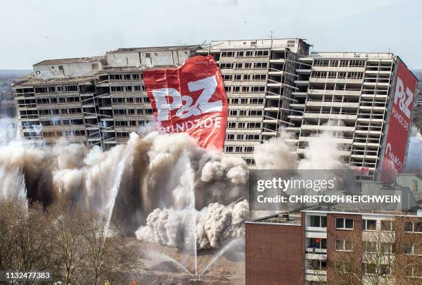 Picture taken on March 24, 2019 shows the demolition of the "Weisser Riese" a high-rise residential building from the 1970s in the Homberg-Hochheide...