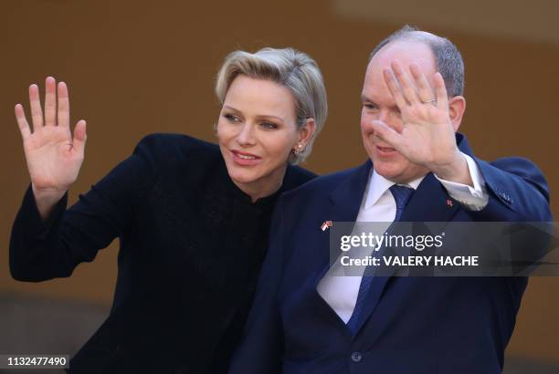 Princess Charlene of Monaco and Prince Albert II of Monaco waves to the Chinese President who leaves after his visit to the Monaco Palace on March...