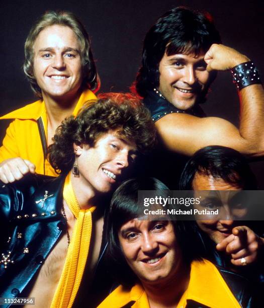 English glam rock band Mud, studio group portrait, London, September 1975, clockwise from top left unknown, Ray Stiles, Dave Mount, Les Gray, Rob...