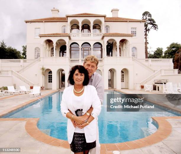 Record producer and songwriter Mickie Most with his wife Christina at their home in Totteridge, London, circa 1988.