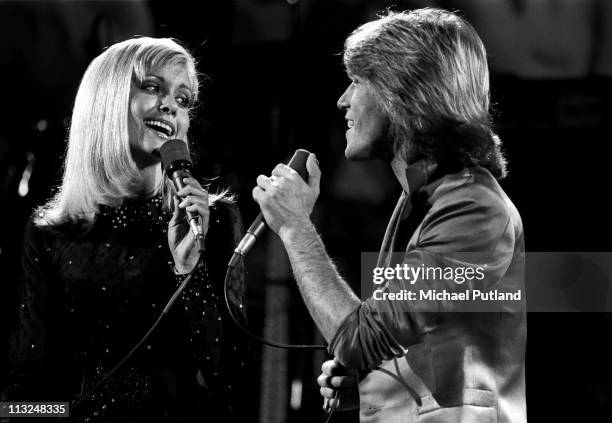 Olivia Newton-John and Andy Gibb perform on stage at Music for UNICEF Concert at The United Nations in New York, on January 9, 1979.