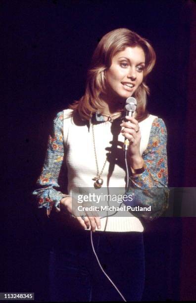 Olivia Newton-John performs on stage, London, 1974.