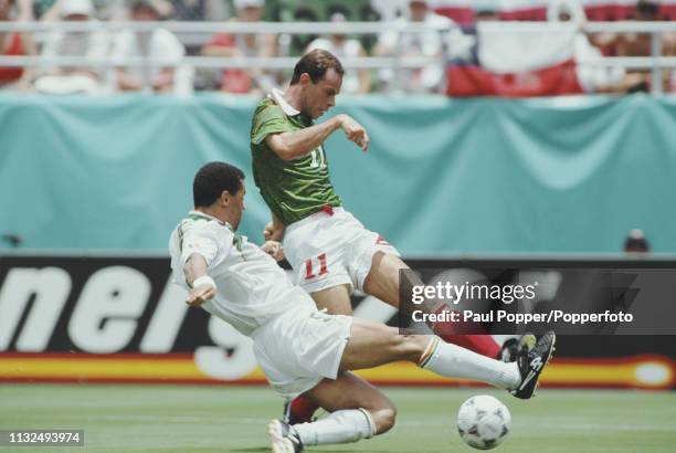 Paul McGrath of Republic of Ireland moves in to tackle Luis Roberto Alves of Mexico for the ball during play between Mexico and Republic of Ireland...