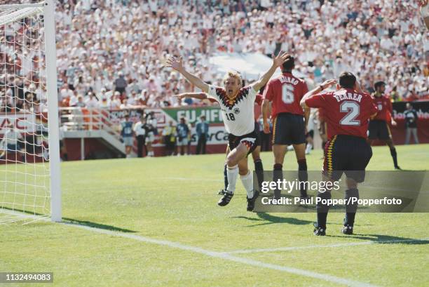 Jurgen Klinsmann of Germany celebrates after scoring an equalising goal during play between Germany and Spain in their 1994 FIFA World Cup Group C...