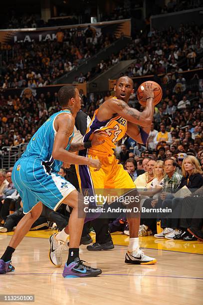 Kobe Bryant of the Los Angeles Lakers moves the ball against the New Orleans Hornets during Game Two of the Western Conference Quarterfinals in the...